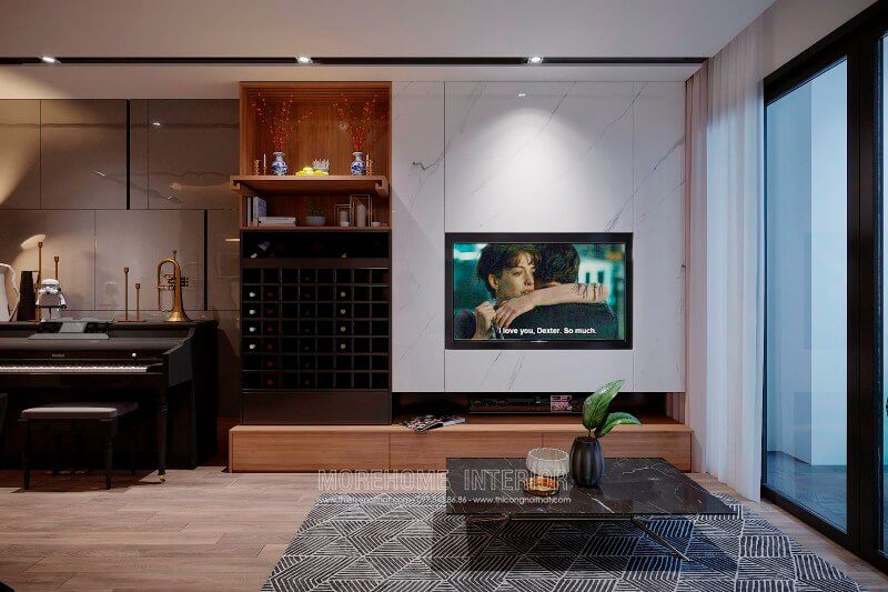 Kệ to vi hiện đại với tone màu vàng trầm ấm là điểm nhấn cuốn hút cho khu vực tiếp khách của gia chủ
